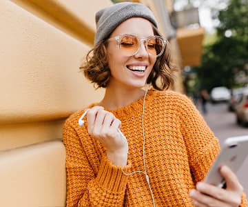 Happy girl with mobile in her hands